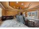 Open concept floor plan with a wet bar, seating, and entertainment area at 10117 Breezy Pines Ct, Weeki Wachee, FL 34613