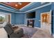 Large main bedroom includes a fireplace, seating, TV, ceiling fan and access to the pool area at 10117 Breezy Pines Ct, Weeki Wachee, FL 34613