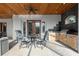 Covered patio with a built-in outdoor kitchen, perfect for grilling and entertaining al fresco at 10117 Breezy Pines Ct, Weeki Wachee, FL 34613