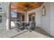 Elegant covered patio, ideal for relaxing with friends, overlooking the pool and landscaped grounds at 10117 Breezy Pines Ct, Weeki Wachee, FL 34613
