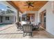 Enjoy outdoor dining on the screened patio, perfect for entertaining guests near the pool and garden at 10117 Breezy Pines Ct, Weeki Wachee, FL 34613