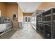 Pet grooming area and kennel with stainless steel grooming tub and kennels at 10117 Breezy Pines Ct, Weeki Wachee, FL 34613