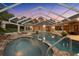 Gorgeous pool area with attached spa, screened enclosure, and deck seating for luxurious outdoor enjoyment at 10117 Breezy Pines Ct, Weeki Wachee, FL 34613