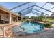 Enclosed pool and patio area with outdoor seating and easy access to indoor kitchen at 10117 Breezy Pines Ct, Weeki Wachee, FL 34613