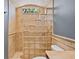 A glass block accent wall in this shower allows for privacy while still allowing light at 10117 Breezy Pines Ct, Weeki Wachee, FL 34613