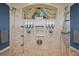 Shower with multiple shower heads and decorative accents for a luxurious spa experience at 10117 Breezy Pines Ct, Weeki Wachee, FL 34613