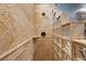 Walk-in shower with light tiled walls and glass block for natural lighting at 10117 Breezy Pines Ct, Weeki Wachee, FL 34613