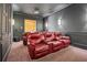 Home theater room featuring plush leather seating and professional-grade sound system for immersive entertainment at 10117 Breezy Pines Ct, Weeki Wachee, FL 34613