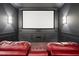 Experience the ultimate movie night in this theater room with a large screen and comfortable seating at 10117 Breezy Pines Ct, Weeki Wachee, FL 34613