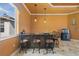 Home bar with seating, storage, and modern lighting in a great room at 10117 Breezy Pines Ct, Weeki Wachee, FL 34613