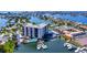 Aerial shot of the luxurious waterfront condo offering stunning views, pool, and boat docks at 10355 Paradise Blvd # 413, Treasure Island, FL 33706