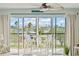 Relax on the balcony, furnished with stylish white seating, and enjoy breathtaking waterfront views and the sunset at 10355 Paradise Blvd # 413, Treasure Island, FL 33706
