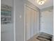 Hallway featuring closet doors and a beach themed wall decor at 10355 Paradise Blvd # 413, Treasure Island, FL 33706