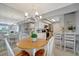 Charming dining area with views into the modern kitchen at 10355 Paradise Blvd # 413, Treasure Island, FL 33706