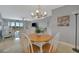 Comfortable living room with dining area, tile floors and balcony access with great views at 10355 Paradise Blvd # 413, Treasure Island, FL 33706