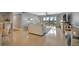 Open-concept living room featuring access to the balcony at 10355 Paradise Blvd # 413, Treasure Island, FL 33706