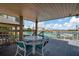 Outdoor deck is the perfect spot for entertaining or relaxing with views of the community pool and waterfront at 10355 Paradise Blvd # 413, Treasure Island, FL 33706