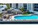 Waterfront pool deck featuring outdoor seating areas at 10355 Paradise Blvd # 413, Treasure Island, FL 33706