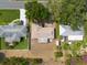 High-angle shot of home with a well-kept yard and landscaping, in a neighborhood with verdant trees, and sidewalks at 11029 90Th Ave, Seminole, FL 33772