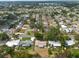 Scenic aerial shot of a quiet neighborhood showcasing lush greenery, tidy lawns, and diverse architectural styles in a suburban setting at 11029 90Th Ave, Seminole, FL 33772