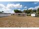 Sprawling backyard with a clean white fence, perfect for outdoor activities and privacy at 11029 90Th Ave, Seminole, FL 33772
