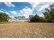 Expansive backyard enclosed by a white fence, offers privacy and plenty of room for outdoor enjoyment at 11029 90Th Ave, Seminole, FL 33772