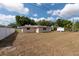 Vast backyard featuring a white fence, offering ample space for recreation and gardening at 11029 90Th Ave, Seminole, FL 33772