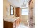 Well-lit bathroom with a marble vanity and neutral tones, offering a clean and serene space at 11029 90Th Ave, Seminole, FL 33772