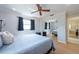 Relaxing bedroom featuring hardwood floors, a mirrored closet, and ample natural light at 11029 90Th Ave, Seminole, FL 33772