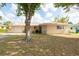 Inviting single-Gathering home with a lush front lawn and beautiful tree offering shade at 11029 90Th Ave, Seminole, FL 33772