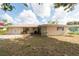 Charming single-story home featuring a well-manicured lawn, mature landscaping, and an attached garage at 11029 90Th Ave, Seminole, FL 33772