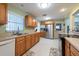 Practical kitchen with modern appliances, spacious countertops and wooden cabinetry at 11029 90Th Ave, Seminole, FL 33772