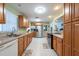 Functional kitchen with modern appliances, spacious countertops and wood cabinets at 11029 90Th Ave, Seminole, FL 33772