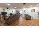 Cozy living room with wood floors, ceiling fan, and comfortable seating arrangement at 11029 90Th Ave, Seminole, FL 33772