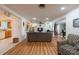 Spacious living room with wood floors, ceiling fan, open layout and neutral tones at 11029 90Th Ave, Seminole, FL 33772