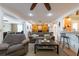 Cozy living room with seating, access to other rooms, and neutral decor at 11029 90Th Ave, Seminole, FL 33772