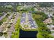 An aerial view of a community with well-maintained homes, scenic ponds, and lush landscaping, creating a serene environment at 11227 Moultrie Pl, Tampa, FL 33625