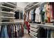 Walk-in closet includes ample shelving and hanging space for organized storage at 11227 Moultrie Pl, Tampa, FL 33625