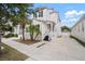 Charming two-story home with a modern exterior, complemented by a well-manicured lawn and a private driveway at 11227 Moultrie Pl, Tampa, FL 33625