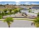 Community playground featuring modern play structures and safety fencing, surrounded by lush landscaping and neighborhood homes at 11227 Moultrie Pl, Tampa, FL 33625
