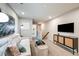 Cozy living room with plush sofa, modern entertainment center, and neutral decor at 1144 Creek Valley Ct, Brandon, FL 33511