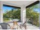 Outdoor balcony with seating and wrought iron railing offering scenic neighborhood views at 116 W Stanley St, Tampa, FL 33604