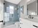 Modern bathroom featuring a sleek glass enclosed shower, a white vanity, and stylish fixtures at 116 W Stanley St, Tampa, FL 33604