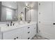 Modern bathroom with double vanity, white countertops, and decorative tile flooring at 116 W Stanley St, Tampa, FL 33604