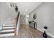 Bright entryway with hardwood floors, a staircase, and modern decor at 116 W Stanley St, Tampa, FL 33604