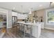 Bright kitchen with a large island, stainless steel appliances, and modern pendant lighting at 116 W Stanley St, Tampa, FL 33604