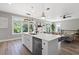 Bright kitchen with a large island and stainless steel appliances; overlooks the living area at 116 W Stanley St, Tampa, FL 33604