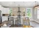 Bright kitchen with a large island, stainless steel appliances, and pendant lighting at 116 W Stanley St, Tampa, FL 33604