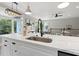 Bright kitchen featuring a large island with stainless steel appliances and modern finishes at 116 W Stanley St, Tampa, FL 33604