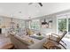 Spacious living room next to the kitchen area with neutral-toned decor at 116 W Stanley St, Tampa, FL 33604